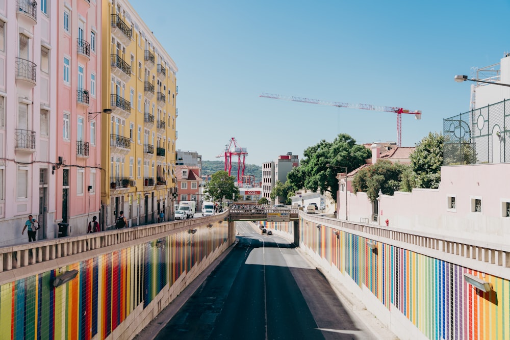 a city street lined with multicolored buildings