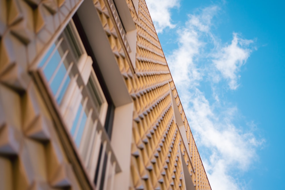 a close up of a building with a blue sky in the background