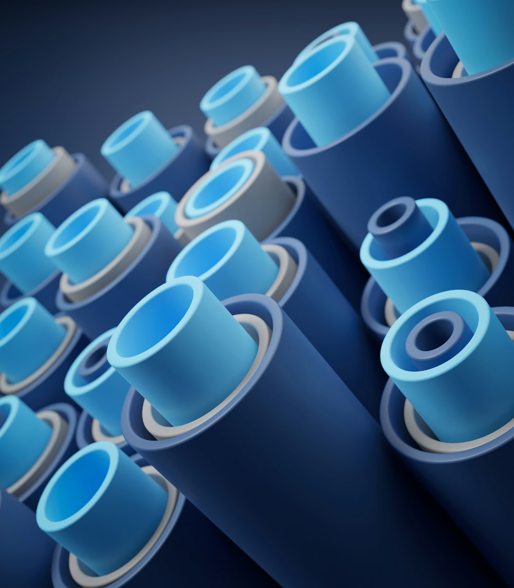 a bunch of blue pipes are lined up together