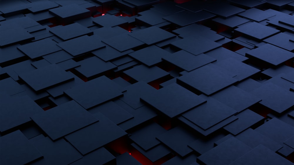 a large group of black squares with red lights