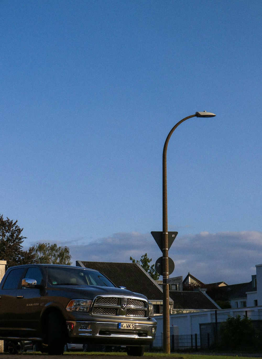 a truck is parked next to a street light