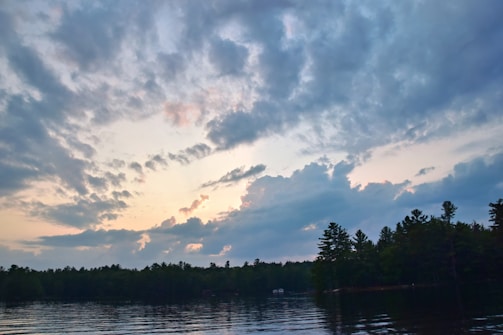 A serene sunrise over a quiet lake symbolizing new beginnings and personal growth.