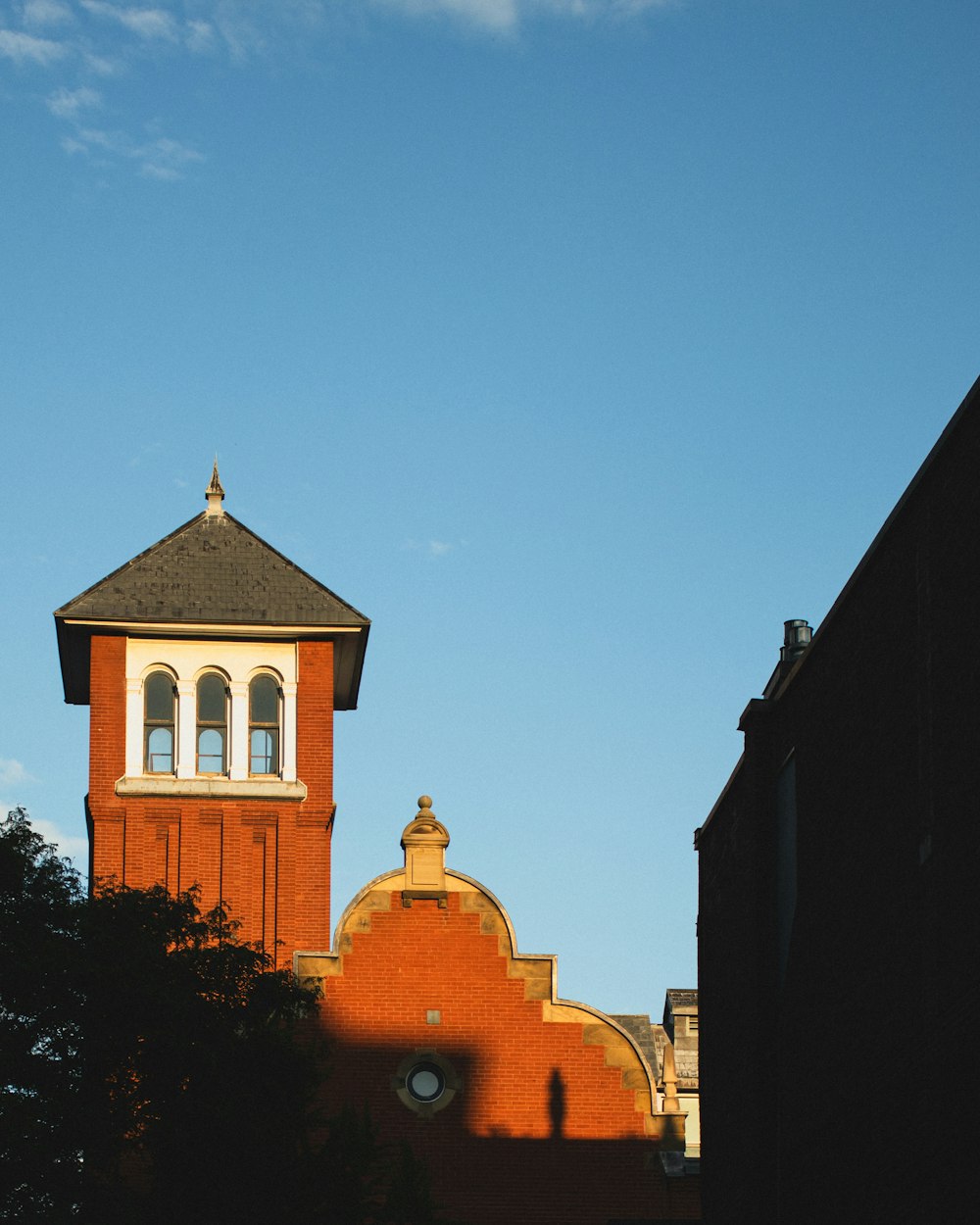 a red brick building with a clock tower