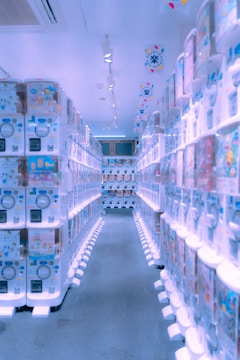 Maintenance staff performing routine checkup on a sleek vending machine in a hotel lobby.