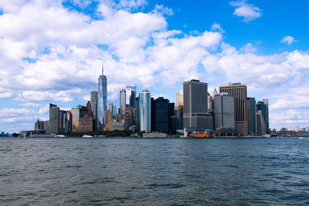 a large body of water with a city in the background