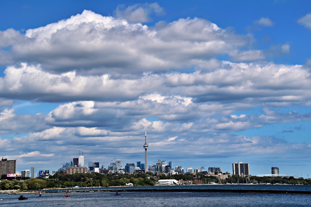 a large body of water with a city in the background