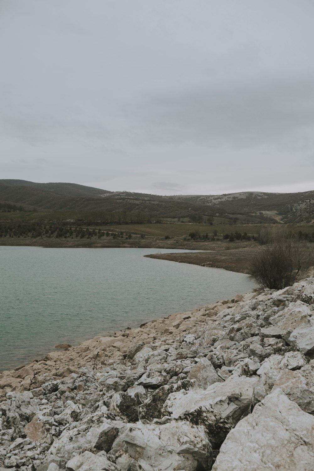 a large body of water surrounded by rocks