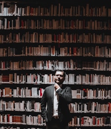 A thoughtful lawyer consulting classic legal books in a cozy study.