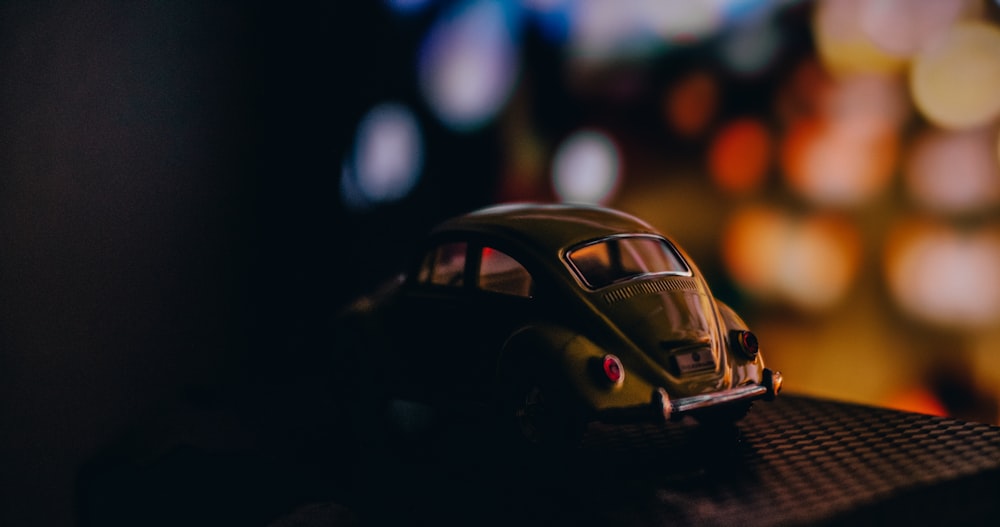 a toy car sitting on top of a table