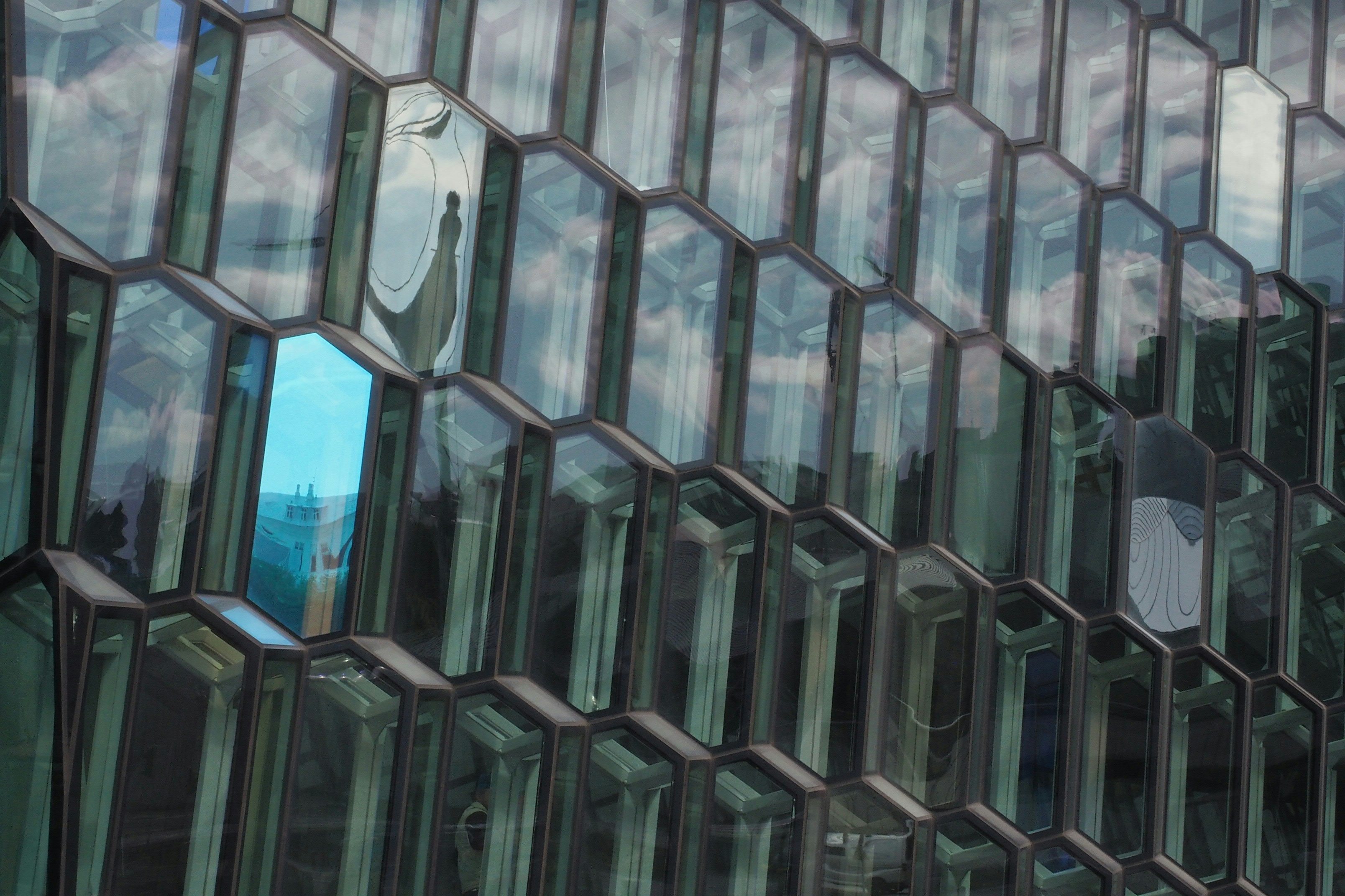 Premium architectural glass facade of a modern commercial building