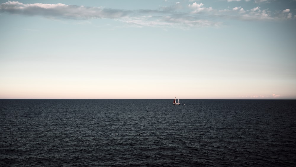 a sailboat in the middle of a large body of water