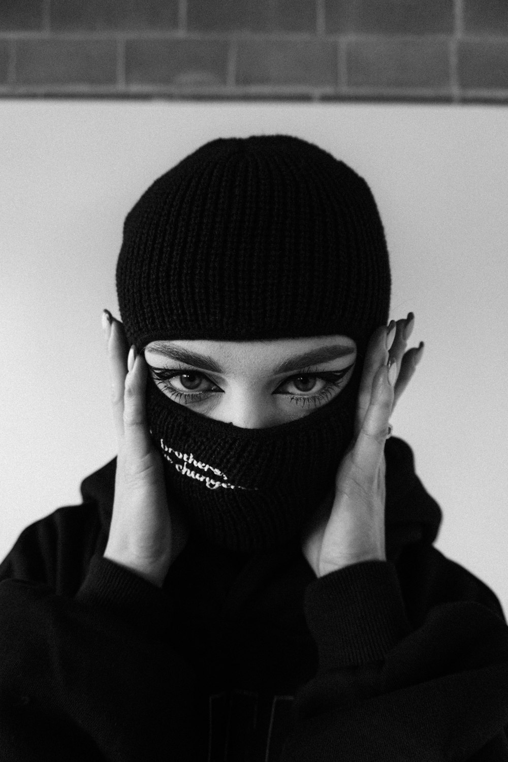 a woman wearing a mask covering her face