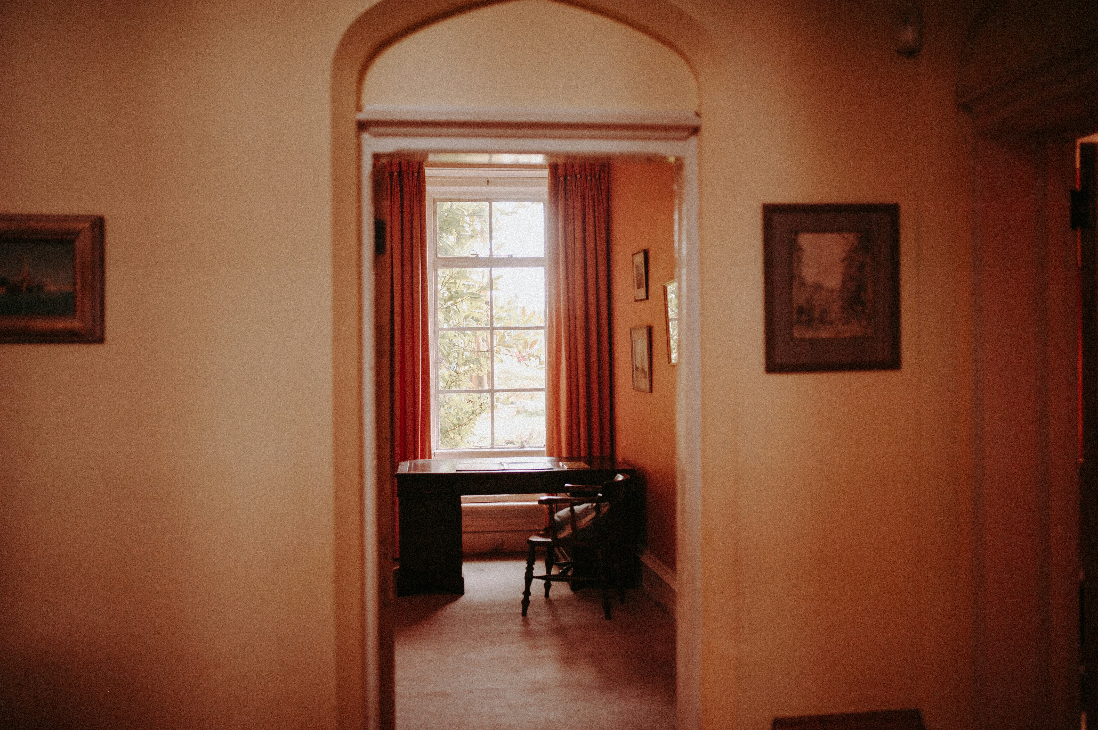 a room with a desk and a chair in it