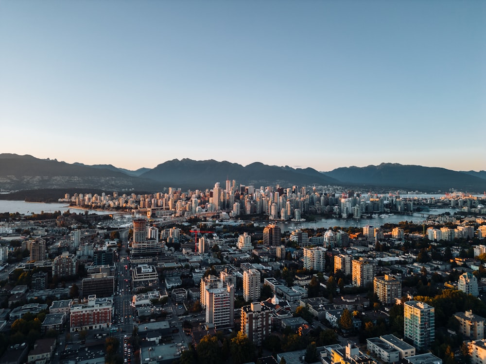 a view of a city with mountains in the background