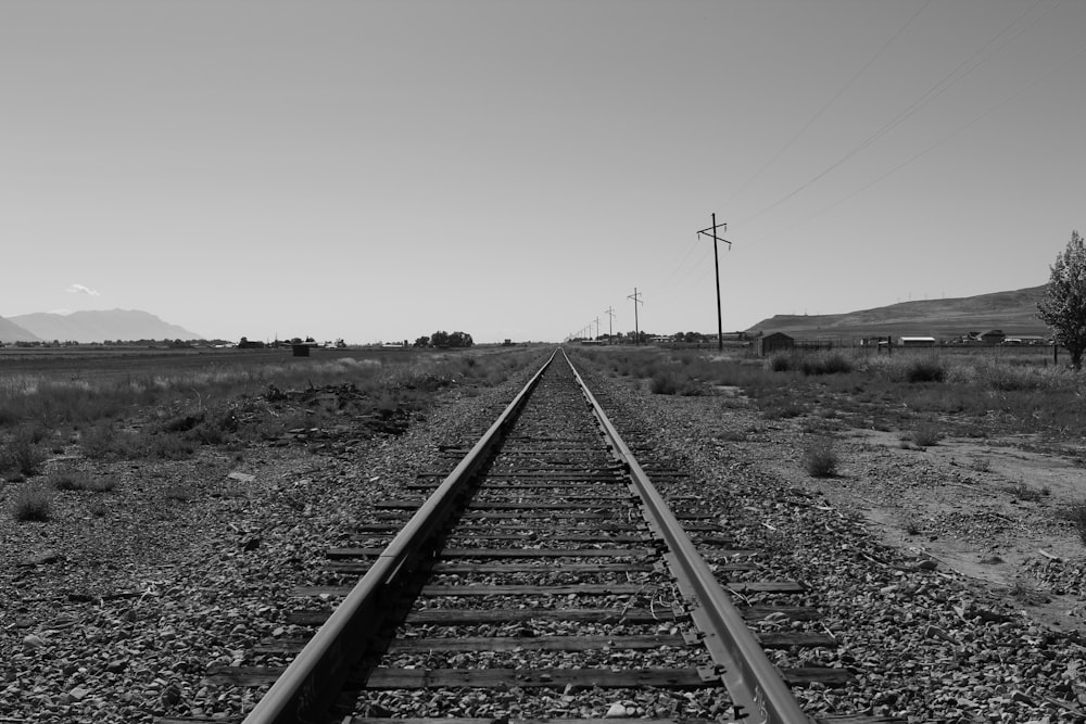 a black and white photo of a train track