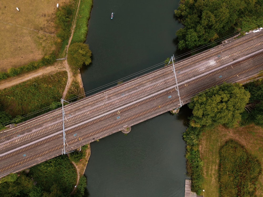 a train crossing a bridge over a river