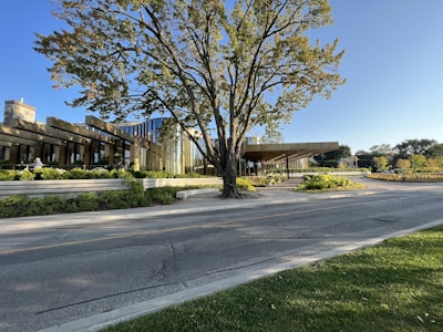A modern architectural building surrounded by greenery.