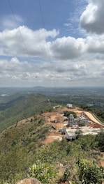 A scenic view of a construction site surrounded by nature.