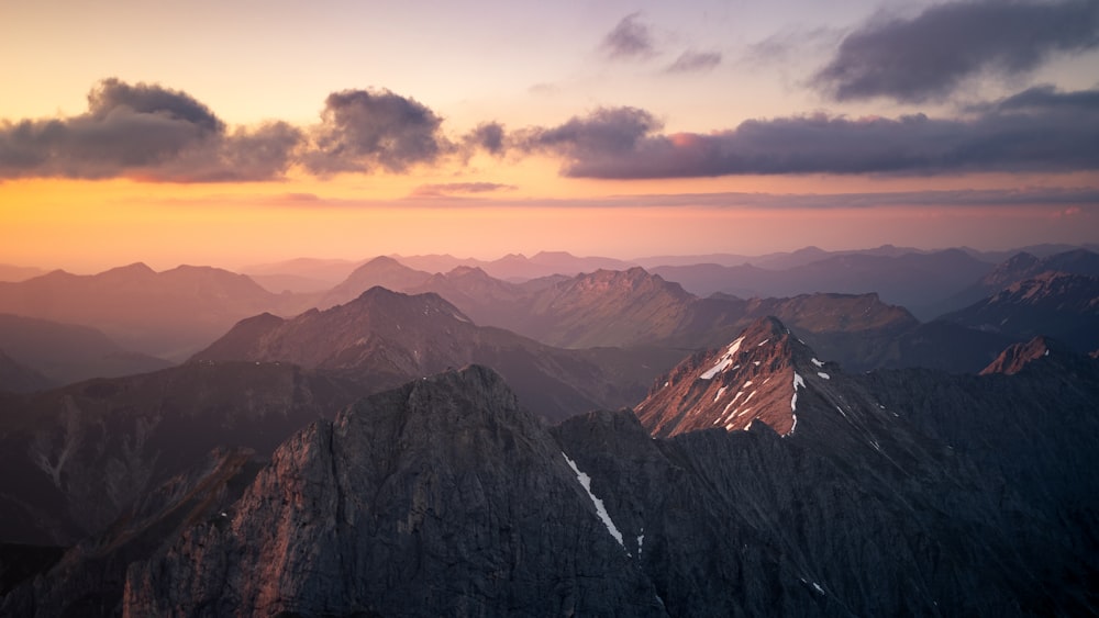 a view of a mountain range at sunset