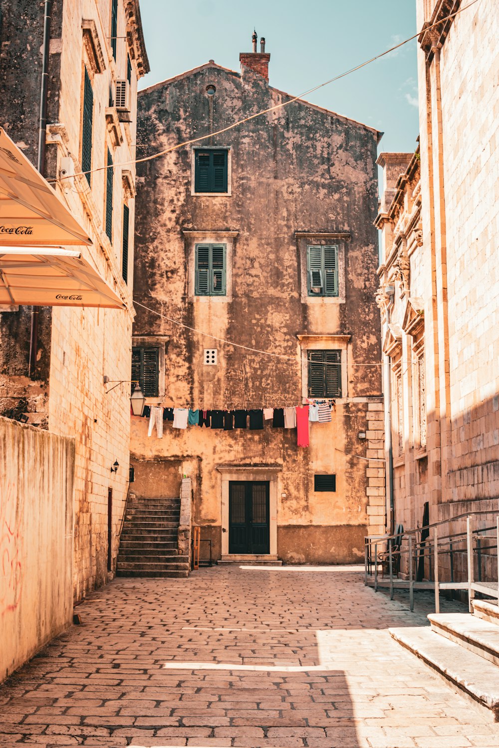 an old building with clothes hanging out to dry