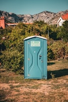 A family-friendly portable toilet setup at a festival.