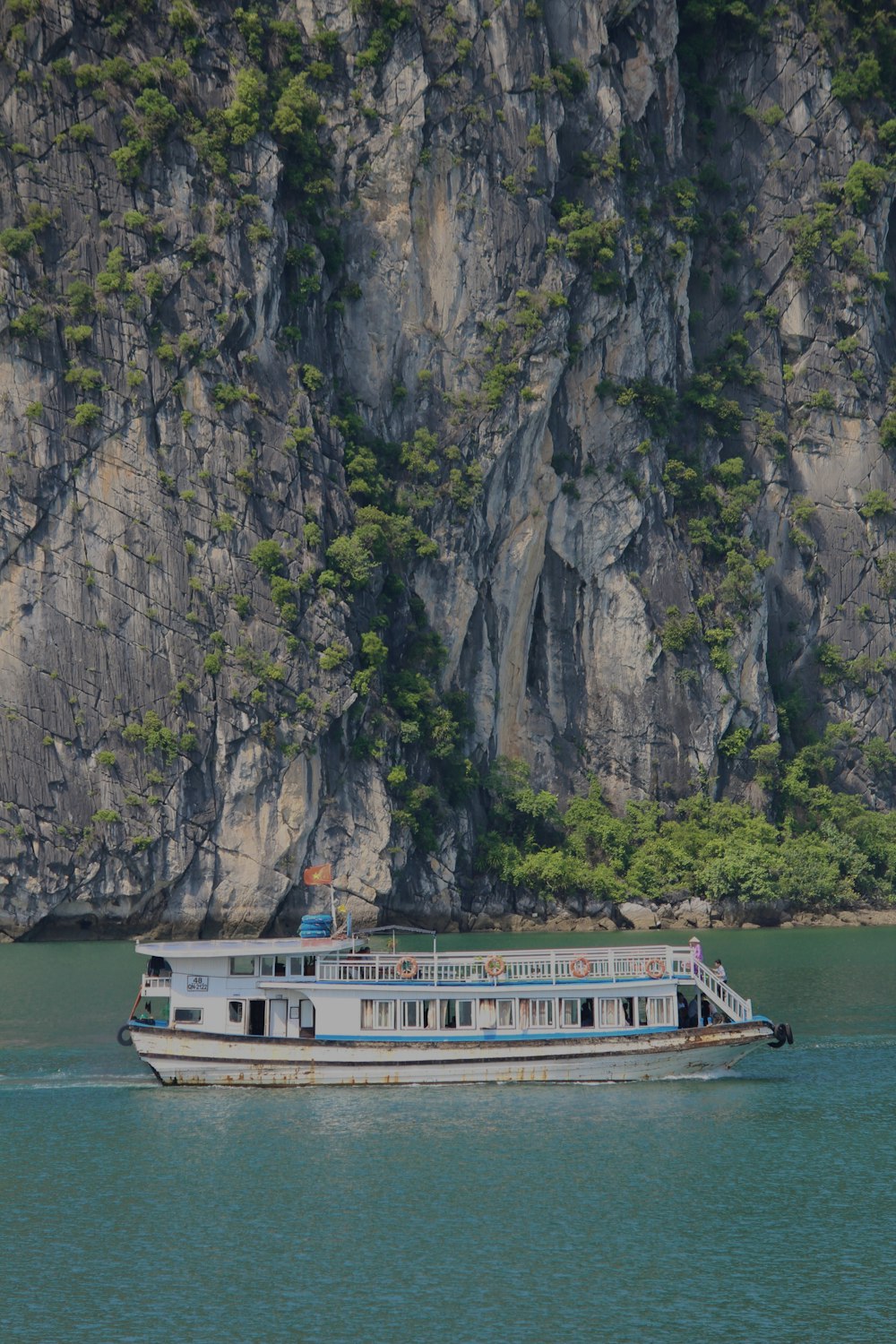 a large boat floating on top of a body of water