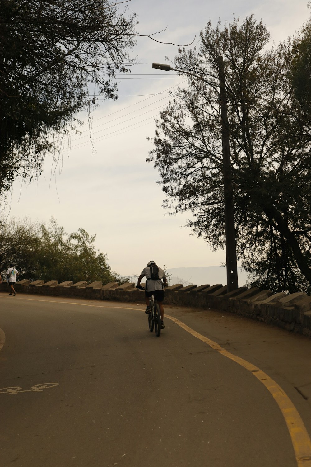 a person riding a bike down a street