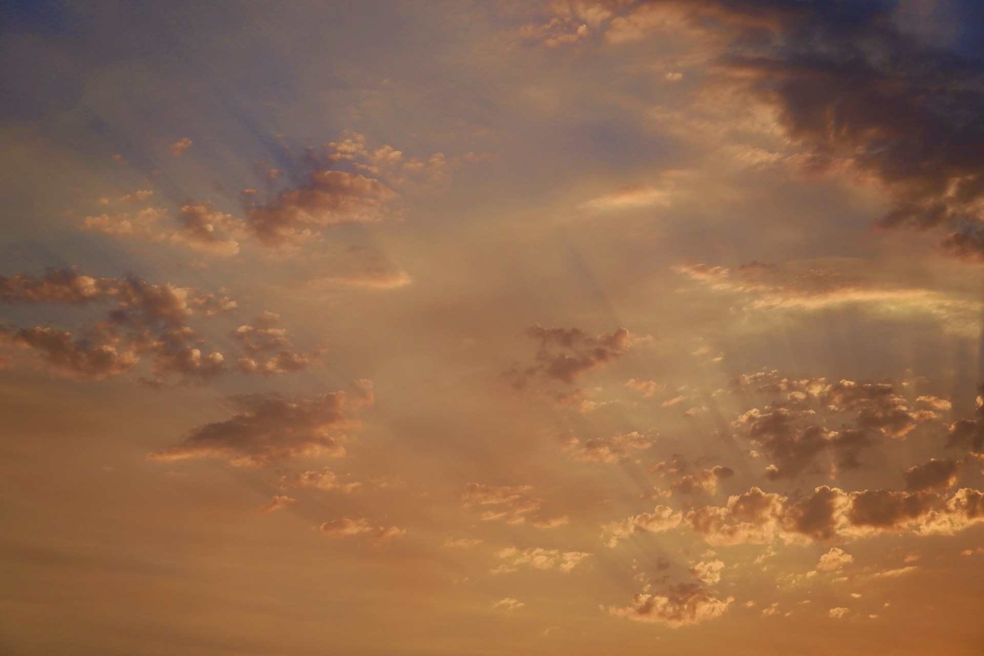 woman wearing yellow long-sleeved dress under white clouds and blue sky during daytime