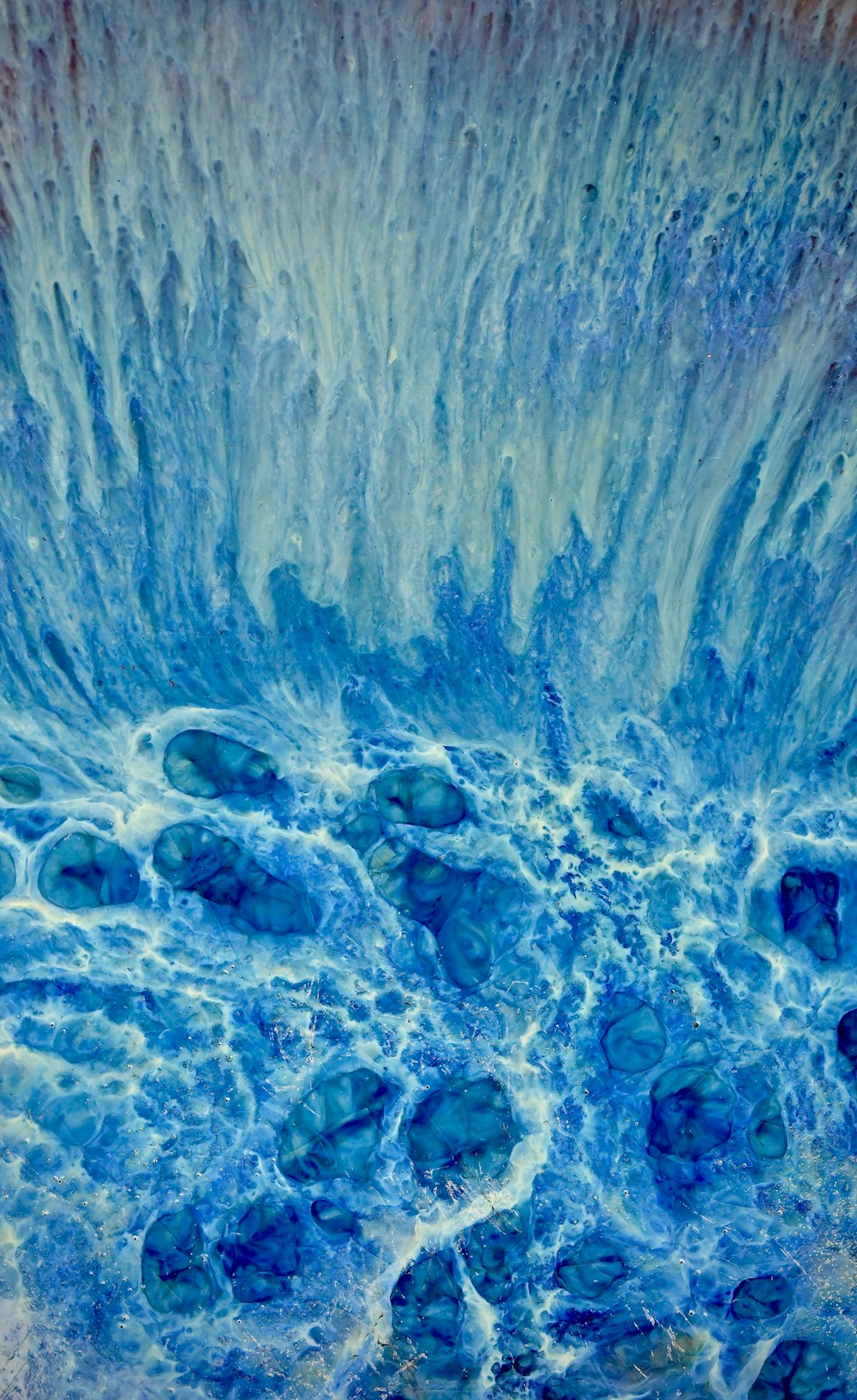 a close up view of a blue ocean wave