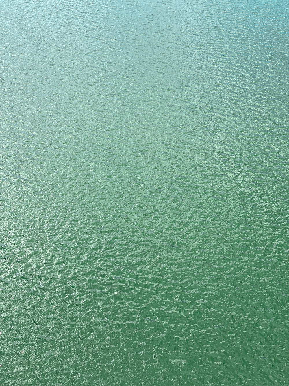 a boat floating on top of a large body of water