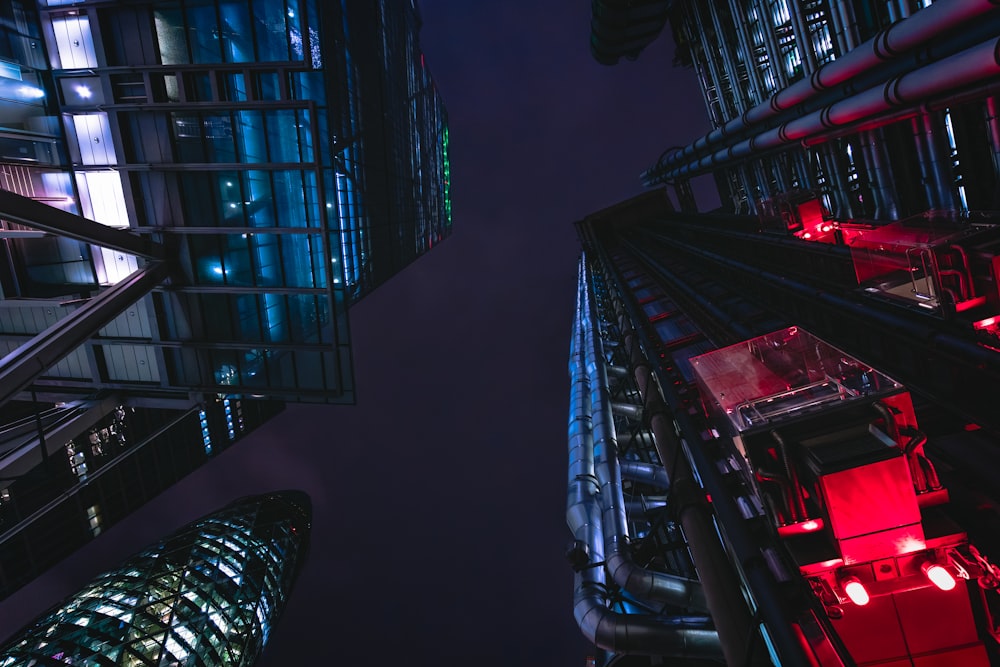 looking up at the top of a skyscraper at night