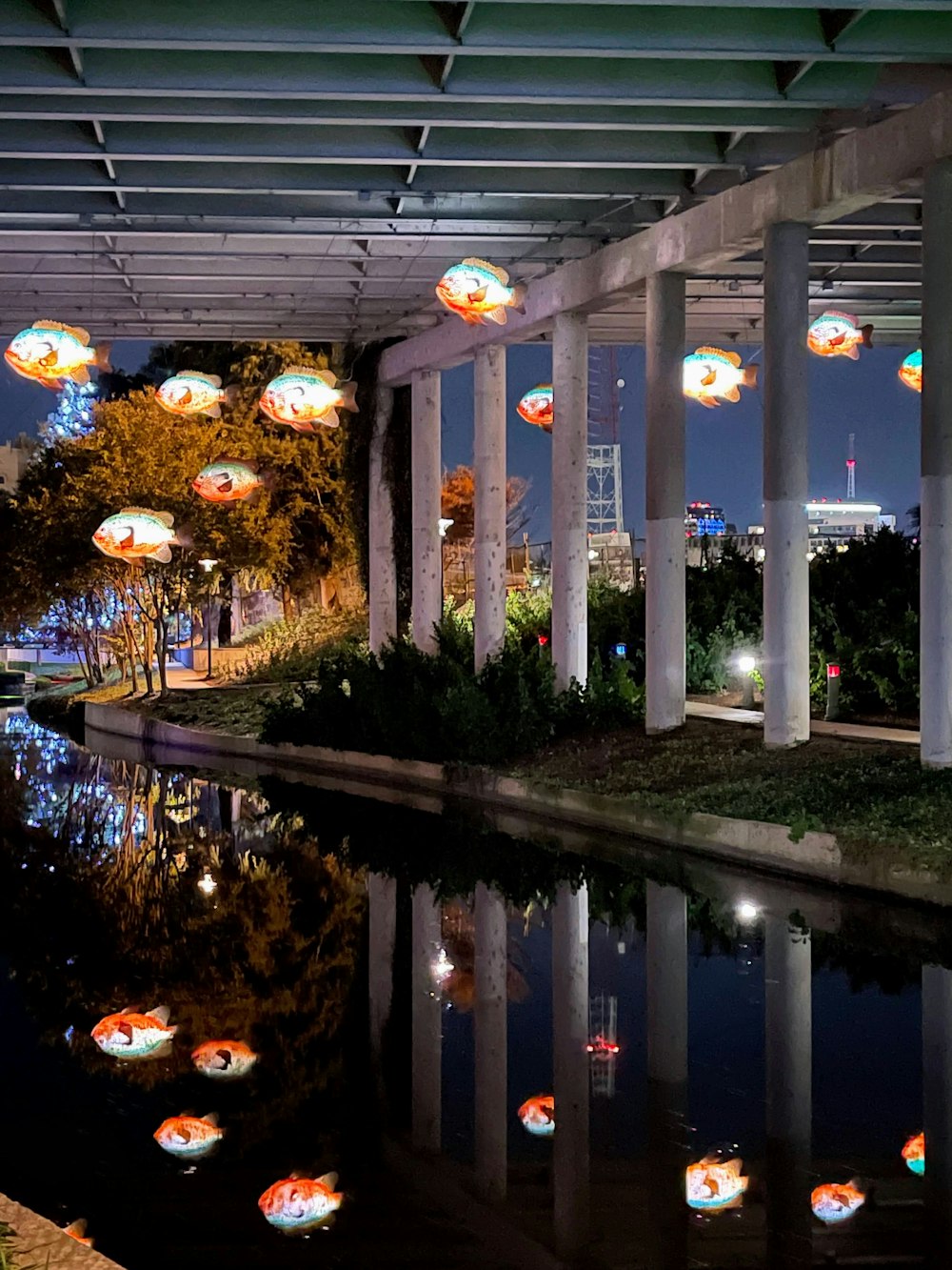 a bunch of umbrellas that are floating in the air