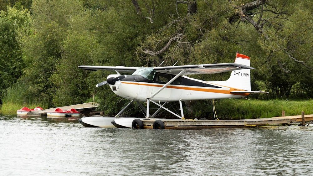 a small plane sitting on top of a body of water