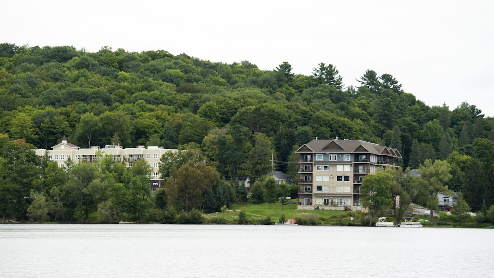 a large building sitting on top of a lush green hillside