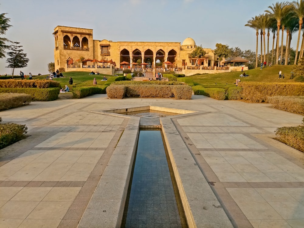 a large building with a pool in the middle of it