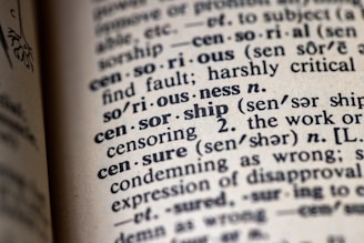 a close up of an open book with some writing on it