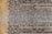 Close-up view of a dictionary page featuring the entry for the word 'environment,' including its pronunciation, definition, and related terms such as 'environmentalist.' The text explains the concept in detail and mentions issues like water pollution and resource use.
