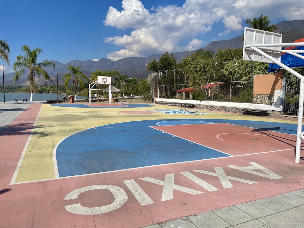 a basketball court with a basketball hoop in the middle of it