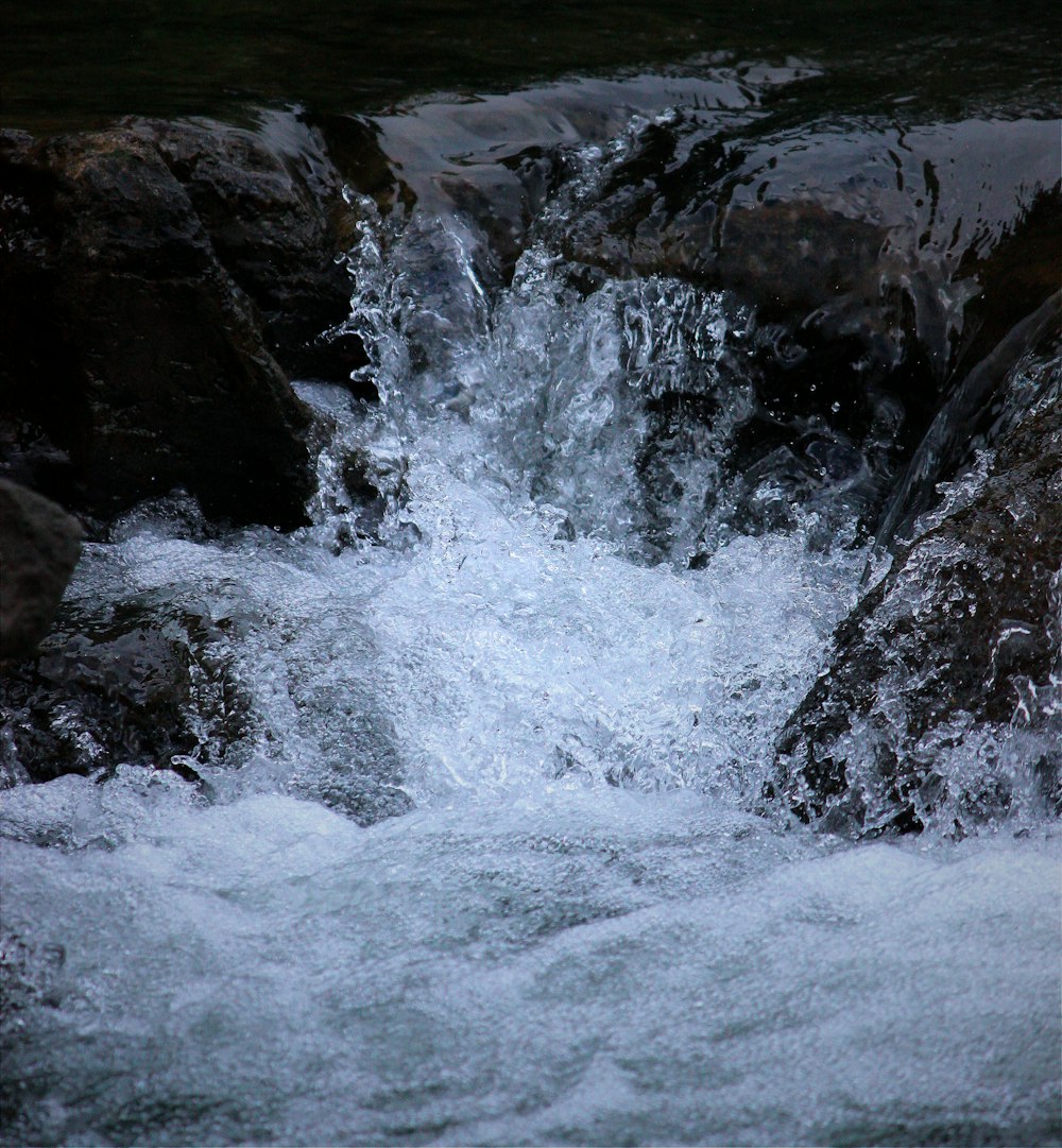 a close up of a river with rocks and water