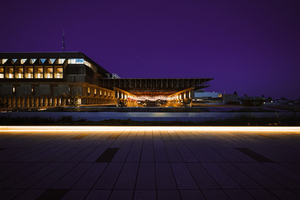 a building lit up with lights at night