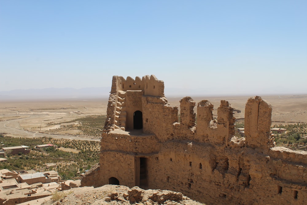 a view of a castle in the middle of the desert