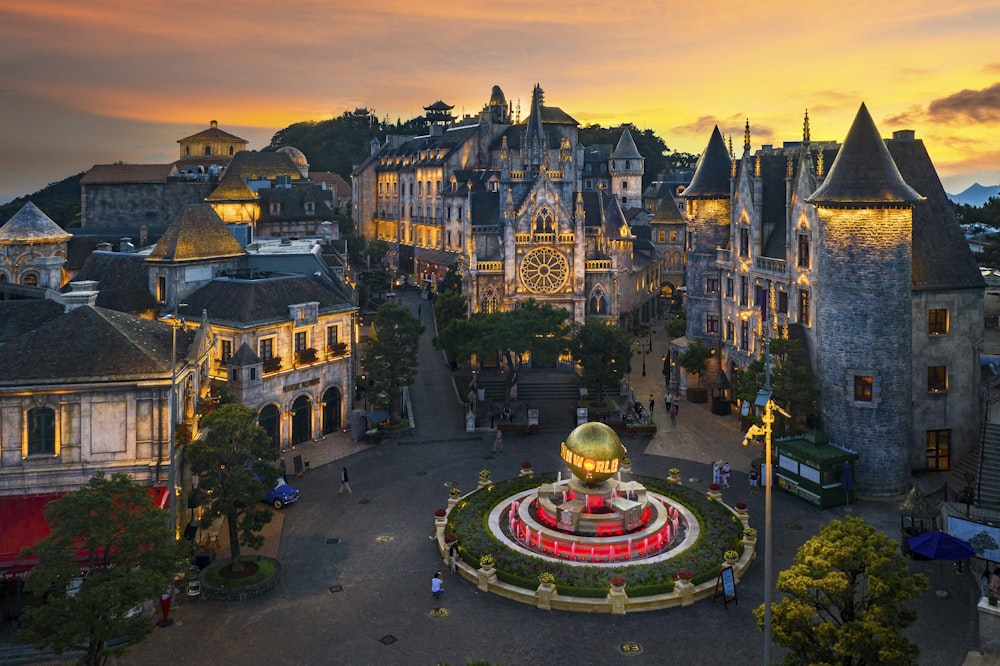 an aerial view of a city with a fountain