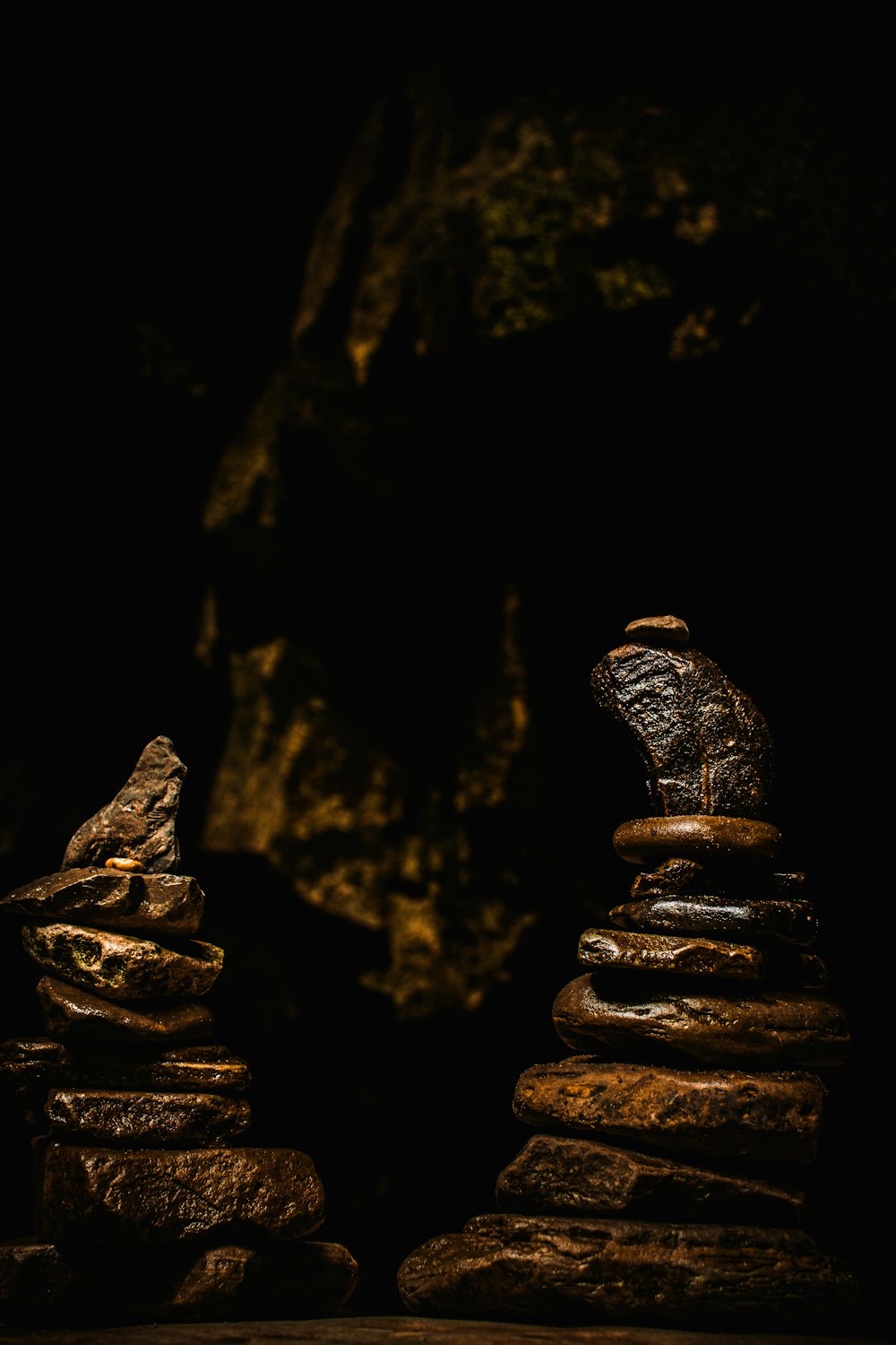 a stack of rocks sitting in the dark