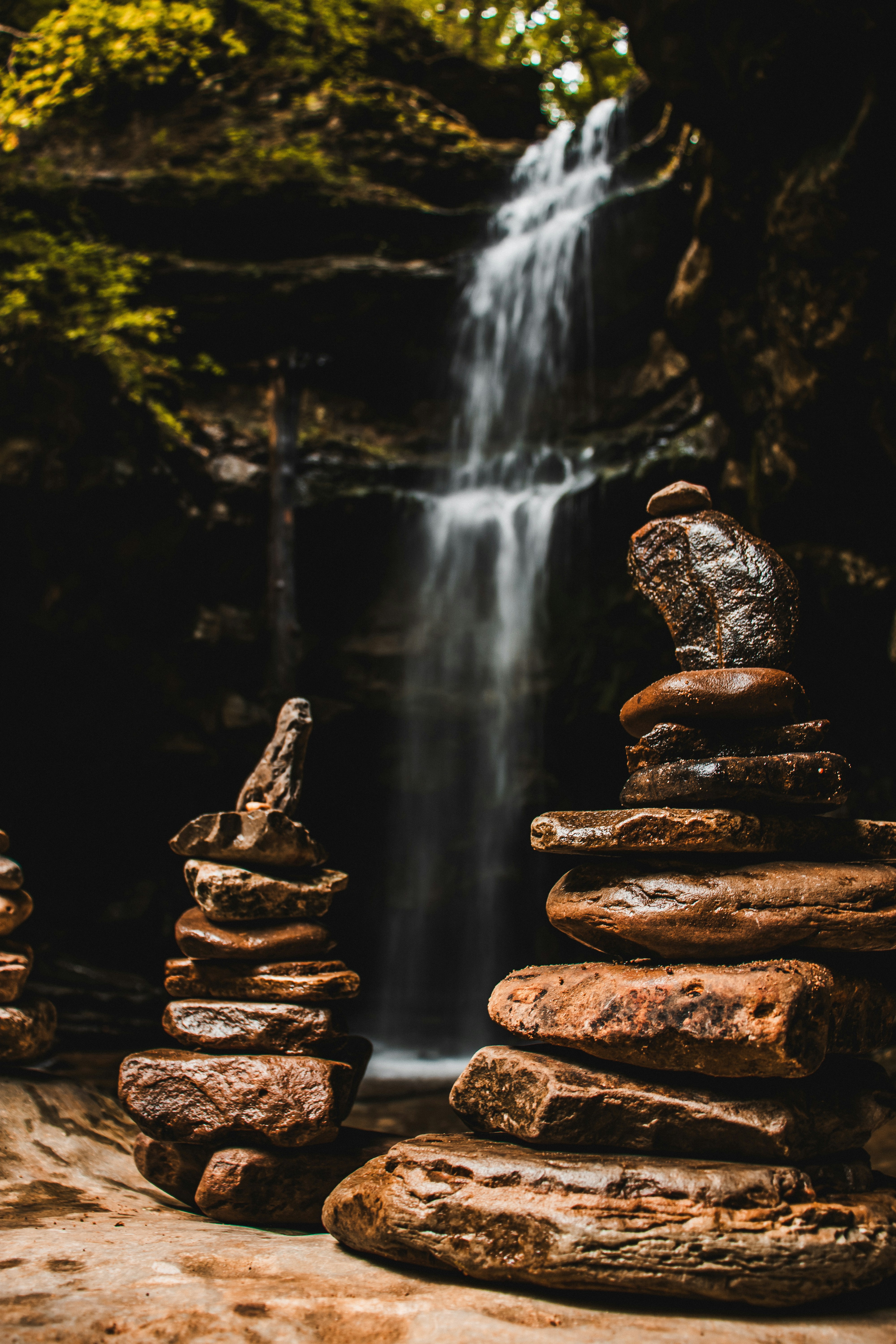 A pile of rocks sitting in front of a waterfall photo – Free Lost creek ...