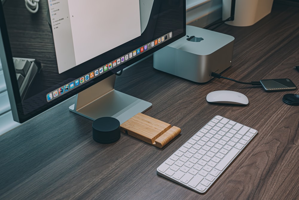 a desktop computer sitting on top of a wooden desk