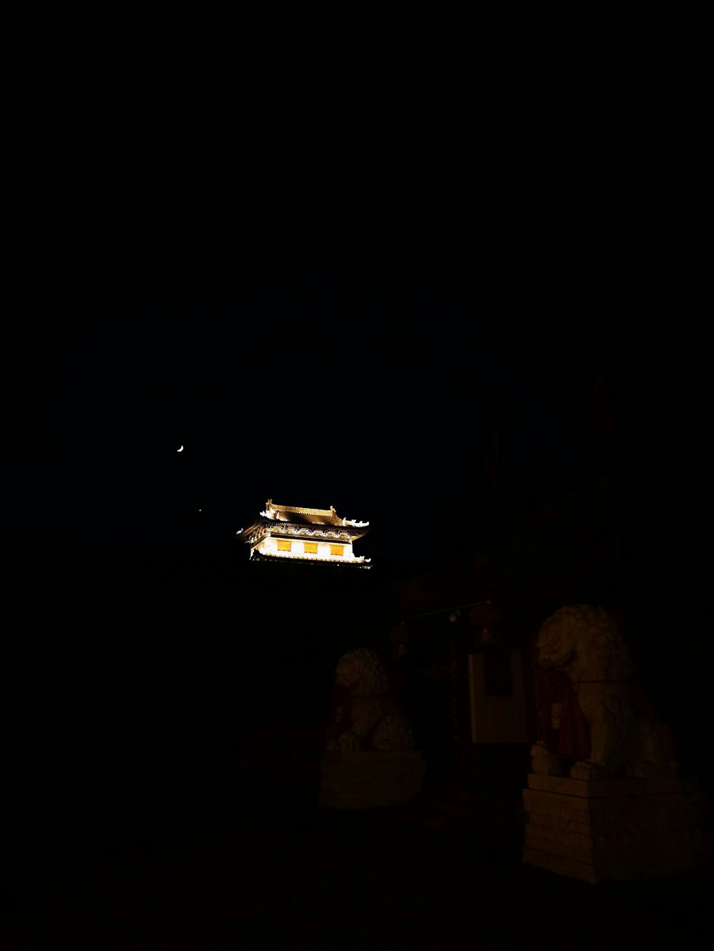 a building lit up in the dark at night