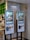 Two digital kiosks for placing takeout orders, displaying images of food items. They are located in a restaurant setting with visible payment interfaces and a sign above indicating 'Takeout Order' in both English and Chinese.
