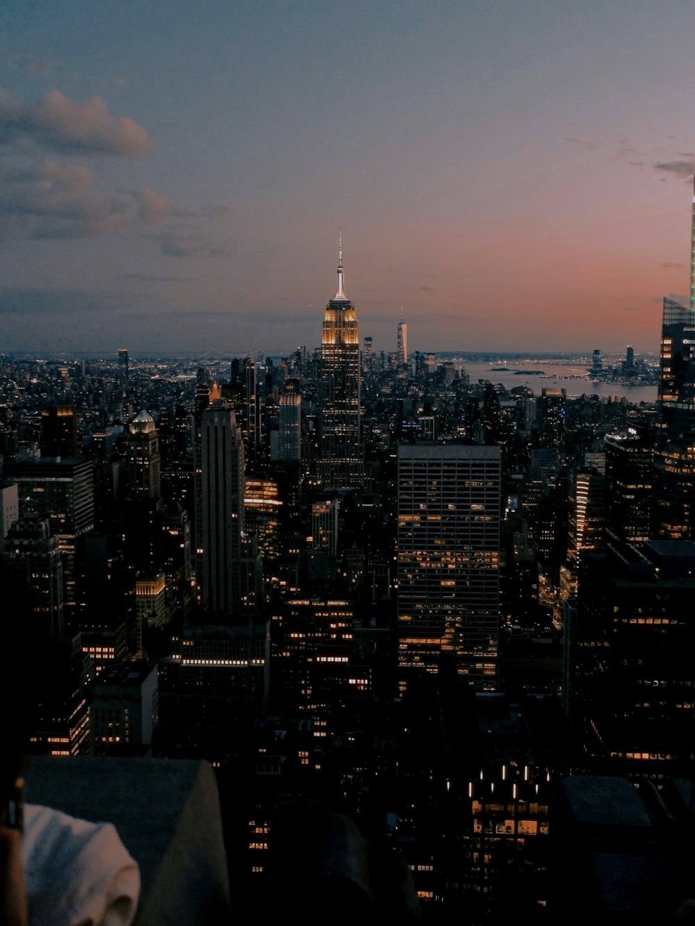 a view of a city at night from the top of a building