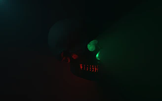 A dark, eerie scene featuring a glowing red skull surrounded by twisted shadows and dripping crimson fog.