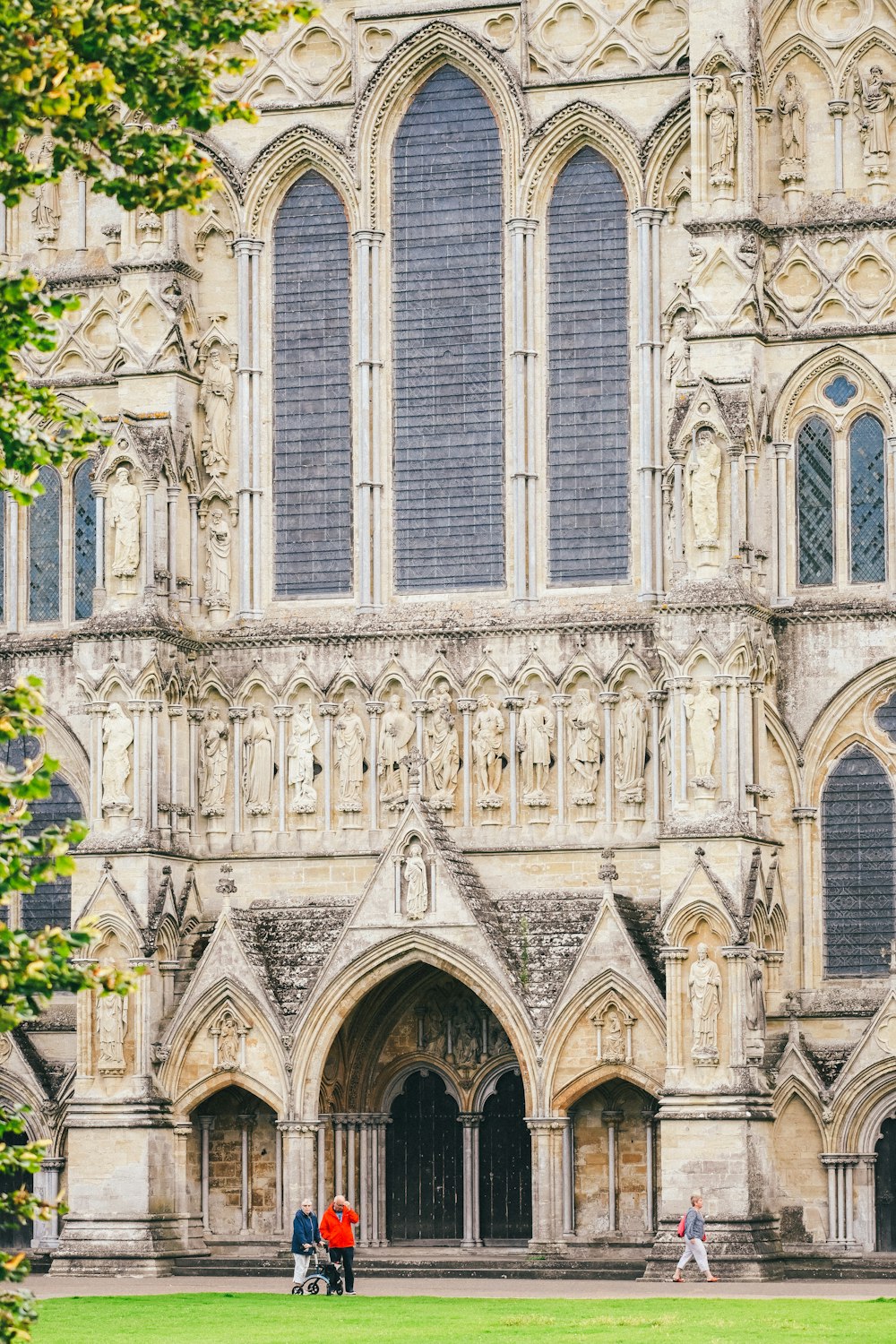 a couple of people standing in front of a large building